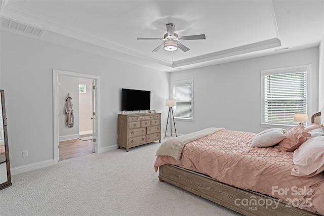 1390 Cedardale Ln, Denver, NC 28037 - carpeted bedroom featuring a tray ceiling, baseboards, a ceiling fan, and ornamental molding