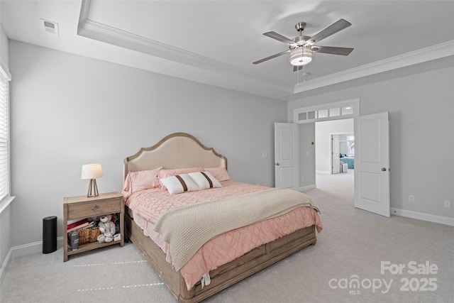 1390 Cedardale Ln, Denver, NC 28037 - bedroom featuring a tray ceiling, carpet floors, baseboards, crown molding, and a ceiling fan