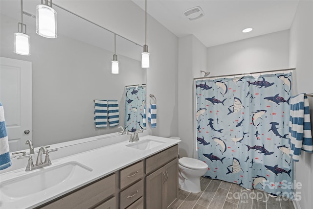 1390 Cedardale Ln, Denver, NC 28037 - full bathroom featuring toilet, wood finished floors, double vanity, and a shower with curtain