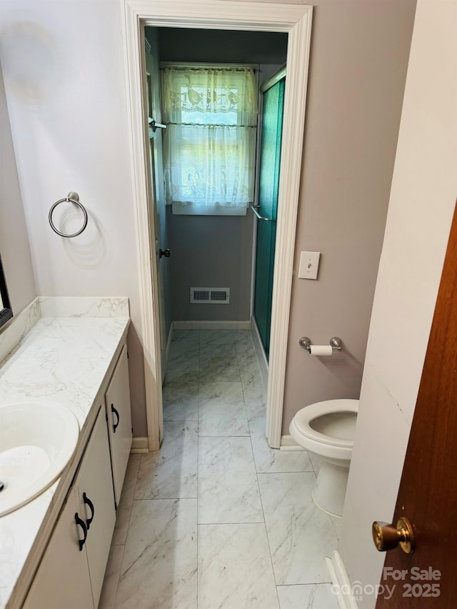 2480 Sumter Hwy, Bishopville, SC 29010 - full bathroom with marble finish floor, visible vents, vanity, baseboards, and a stall shower