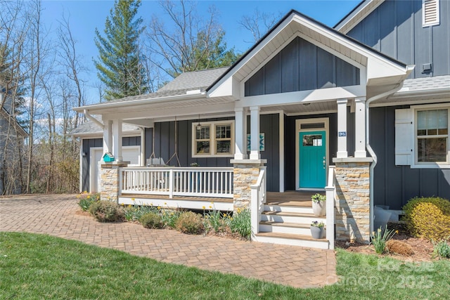 95 Greenwells Glory Dr, Biltmore Lake, NC 28715 - view of front of home with board and batten siding, covered porch, and a shingled roof