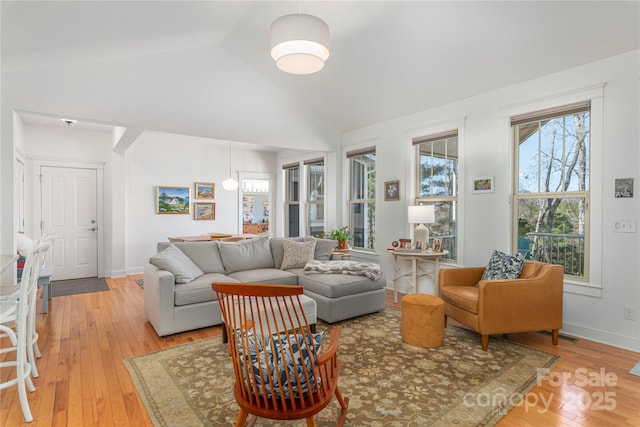 95 Greenwells Glory Dr, Biltmore Lake, NC 28715 - living area with light wood finished floors, lofted ceiling, and baseboards