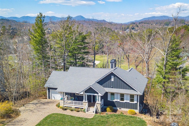 95 Greenwells Glory Dr, Biltmore Lake, NC 28715 - view of front of house with board and batten siding, dirt driveway, a mountain view, and a garage