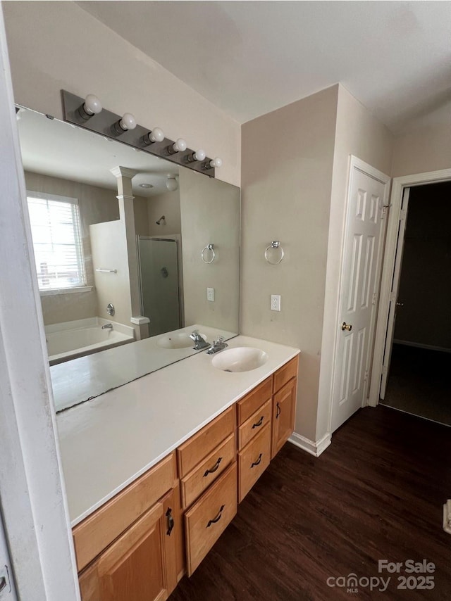 1507 Rumstone Ln, Charlotte, NC 28262 - bathroom with a shower stall, wood finished floors, vanity, and a bathtub