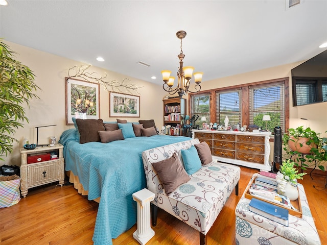 bedroom with recessed lighting, light wood-style flooring, visible vents, and a notable chandelier