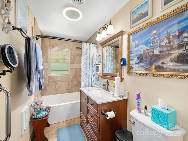bathroom featuring shower / bath combination with curtain, toilet, vanity, and visible vents
