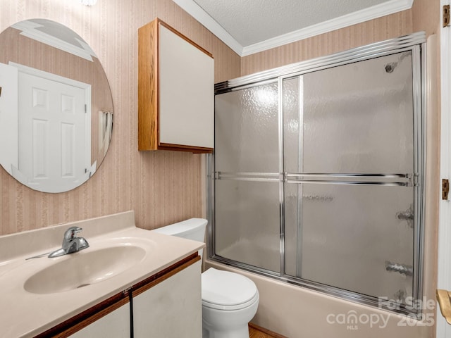 full bath with wallpapered walls, combined bath / shower with glass door, toilet, vanity, and ornamental molding