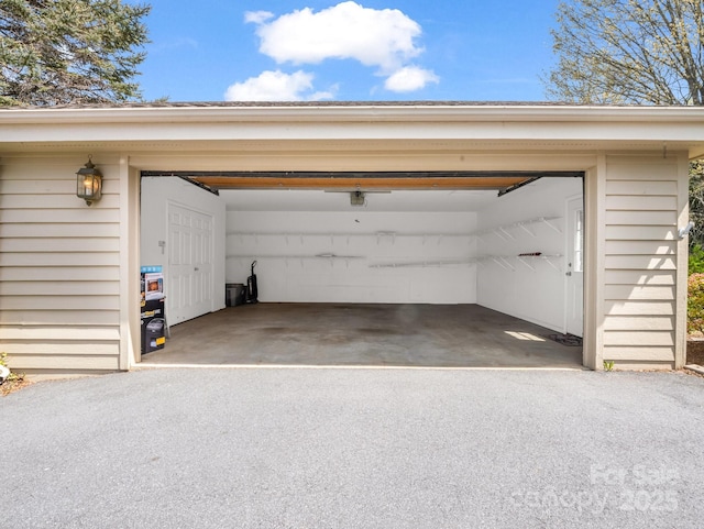 garage featuring aphalt driveway