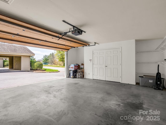 garage featuring a garage door opener