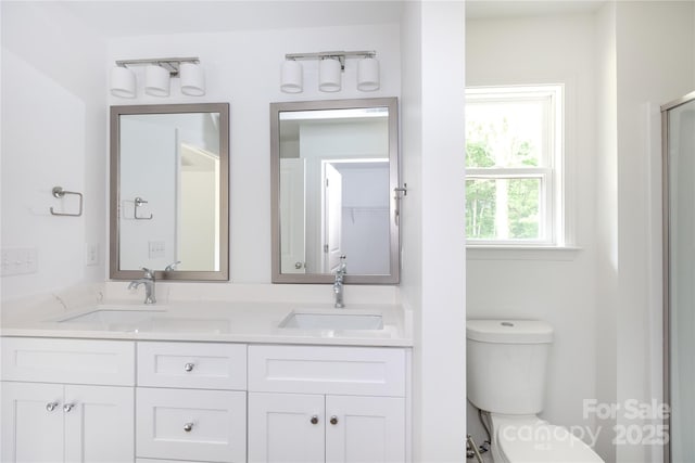 6223 Rockwell Blvd W, Charlotte, NC 28269 - full bath featuring double vanity, toilet, and a sink
