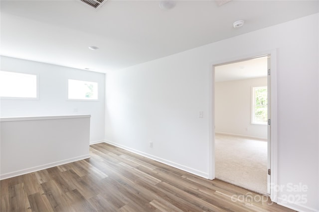 6223 Rockwell Blvd W, Charlotte, NC 28269 - unfurnished room with baseboards, visible vents, and wood finished floors