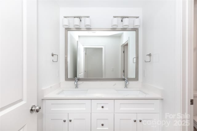 6223 Rockwell Blvd W, Charlotte, NC 28269 - bathroom with toilet, double vanity, and a sink