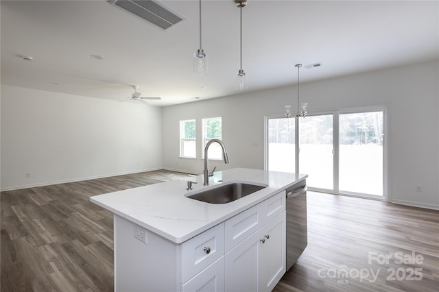 6223 Rockwell Blvd W, Charlotte, NC 28269 - kitchen featuring a sink, visible vents, open floor plan, dishwasher, and wood finished floors