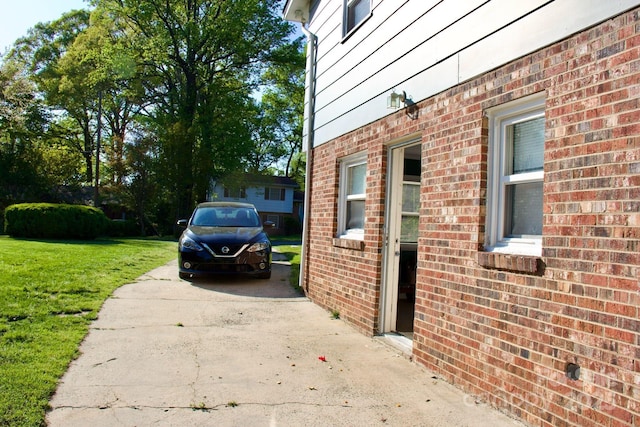 920 Squirrel Hill Rd, Charlotte, NC 28213 - view of property exterior featuring driveway, a lawn, and brick siding