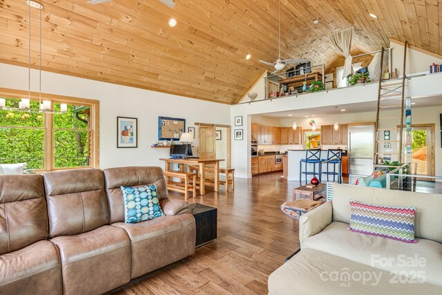 living room with recessed lighting, wood finished floors, a ceiling fan, wood ceiling, and high vaulted ceiling