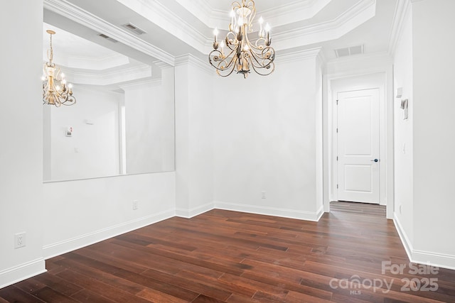 17408 Summer Place Dr, Cornelius, NC 28031 - unfurnished dining area with a chandelier, hardwood / wood-style flooring, a tray ceiling, baseboards, and ornamental molding