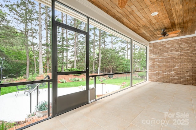17408 Summer Place Dr, Cornelius, NC 28031 - unfurnished sunroom with a ceiling fan and view of scattered trees