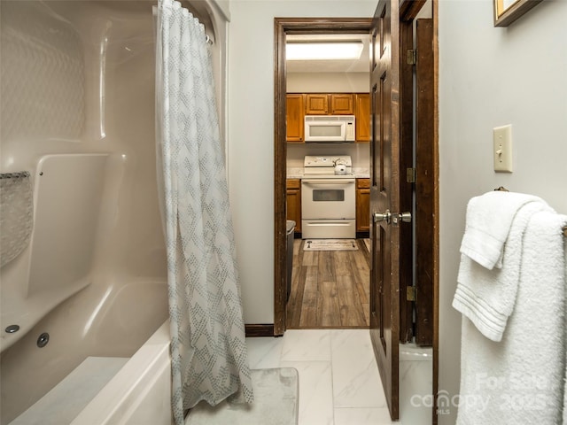 376 Overlook Dr Unit 1, Burnsville, NC 28714 - bathroom featuring shower / bath combo with shower curtain and marble finish floor