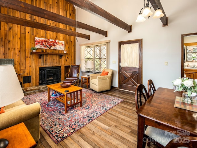 376 Overlook Dr Unit 1, Burnsville, NC 28714 - living room with a fireplace, plenty of natural light, lofted ceiling with beams, and wood finished floors