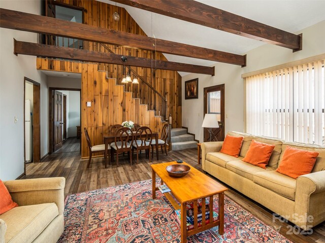376 Overlook Dr Unit 1, Burnsville, NC 28714 - living area with wood walls, stairway, hardwood / wood-style floors, and beamed ceiling