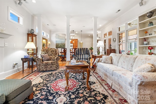 962 Blakeley Walk, Rock Hill, SC 29732 - living room featuring baseboards, decorative columns, wood finished floors, and crown molding