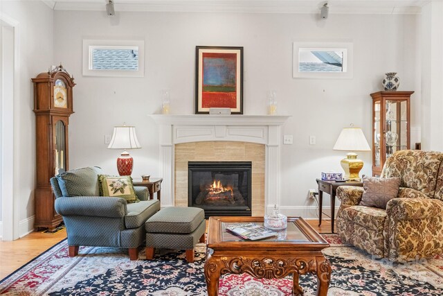 962 Blakeley Walk, Rock Hill, SC 29732 - sitting room featuring a tile fireplace, baseboards, crown molding, and wood finished floors