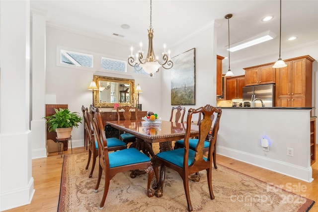 962 Blakeley Walk, Rock Hill, SC 29732 - dining room featuring light wood-type flooring, visible vents, crown molding, and a notable chandelier