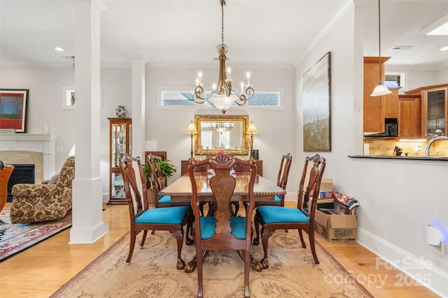 962 Blakeley Walk, Rock Hill, SC 29732 - dining room featuring a notable chandelier, baseboards, light wood-style floors, and ornamental molding