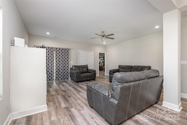 living area with recessed lighting, light wood-style floors, and a ceiling fan