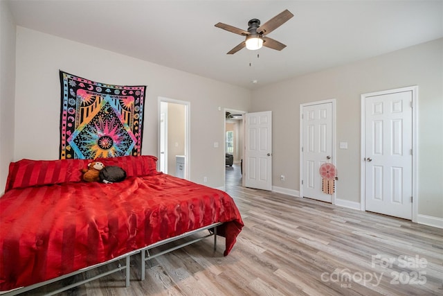 bedroom featuring baseboards, a ceiling fan, and wood finished floors