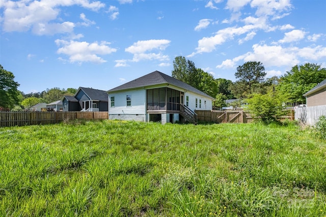 back of property featuring a sunroom, fence, and crawl space