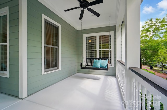 balcony with covered porch and ceiling fan