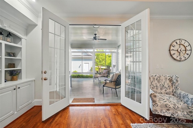 doorway to outside with french doors, crown molding, wood finished floors, and ceiling fan