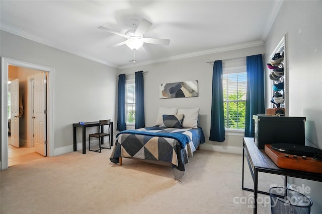 bedroom featuring baseboards, ornamental molding, and carpet