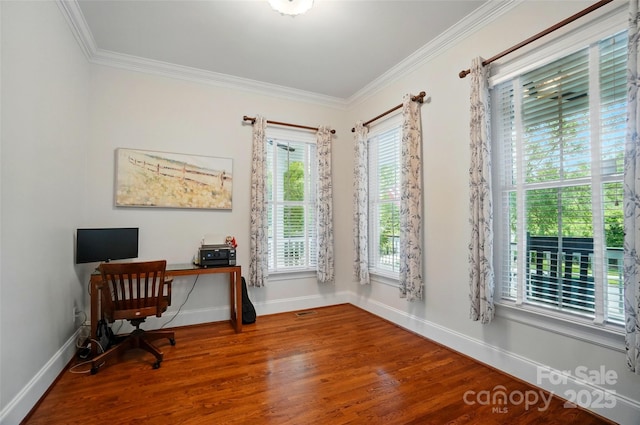 office area featuring baseboards, a healthy amount of sunlight, and wood finished floors