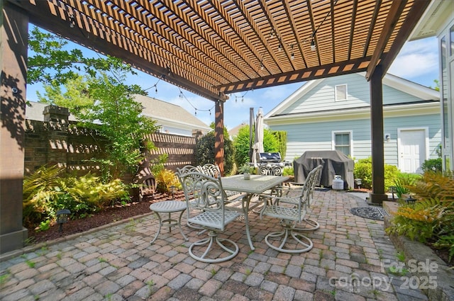 view of patio / terrace with fence, a pergola, outdoor dining area, and grilling area