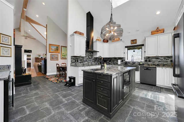 kitchen with white cabinets, wall chimney range hood, ceiling fan, a sink, and black appliances