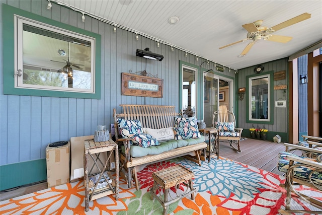 exterior space featuring a ceiling fan