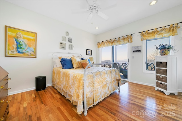 bedroom with baseboards, recessed lighting, access to exterior, and light wood-type flooring