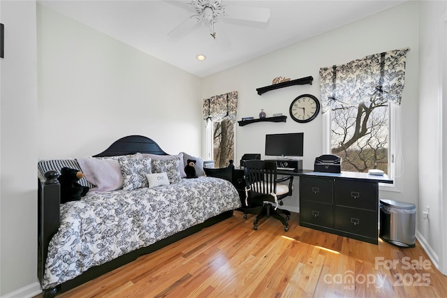 bedroom with baseboards, recessed lighting, light wood-style flooring, and ceiling fan