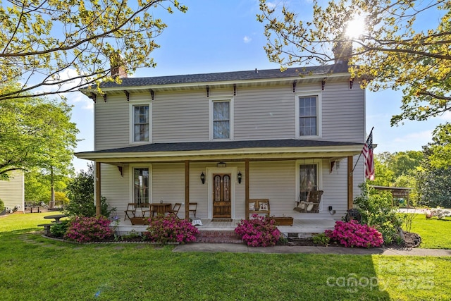 italianate house with a front lawn, a shingled roof, covered porch, and a chimney