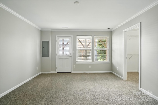 entryway featuring electric panel, baseboards, carpet floors, and ornamental molding