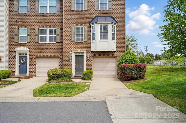 7753 Jackson Pond Dr, Charlotte, NC 28273 - view of property with concrete driveway, brick siding, an attached garage, and a front yard