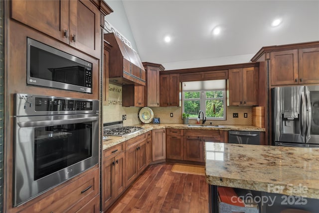 334 Willow Top Ln, Lake Lure, NC 28746 - kitchen featuring appliances with stainless steel finishes, dark wood-style flooring, backsplash, light stone countertops, and recessed lighting