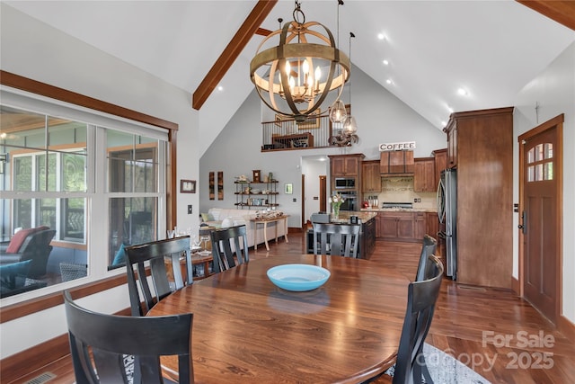 334 Willow Top Ln, Lake Lure, NC 28746 - dining room featuring high vaulted ceiling, a chandelier, dark wood-type flooring, and beam ceiling