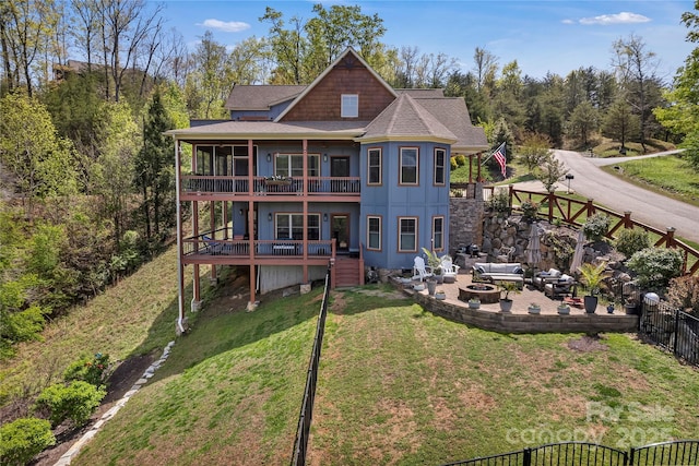 334 Willow Top Ln, Lake Lure, NC 28746 - rear view of house with a balcony, a patio, roof with shingles, a deck, and an outdoor living space with a fire pit