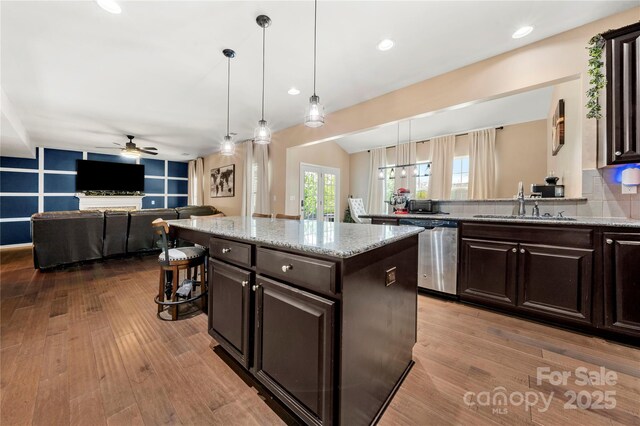 2262 Galloway Ln SW, Concord, NC 28025 - kitchen with dishwasher, a ceiling fan, wood finished floors, and a sink