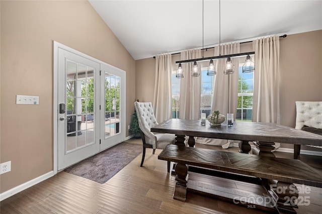 2262 Galloway Ln SW, Concord, NC 28025 - dining space featuring lofted ceiling, baseboards, french doors, and wood finished floors