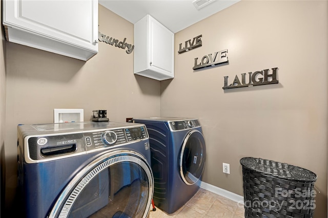 2262 Galloway Ln SW, Concord, NC 28025 - laundry room with cabinet space, washing machine and dryer, visible vents, and baseboards