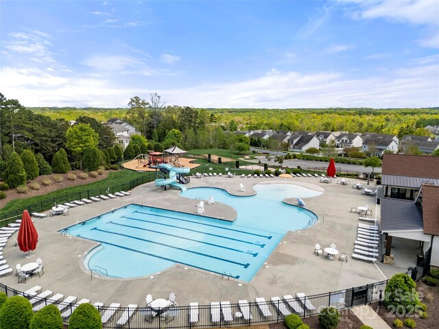 2262 Galloway Ln SW, Concord, NC 28025 - community pool featuring fence, a water slide, and a patio